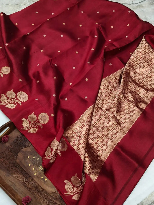Deep red silk saree with gold zari buti and floral border